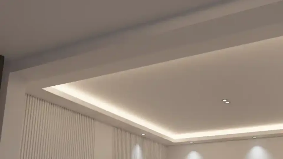 Ceiling perimeter with concealed warm lighting above curtains.